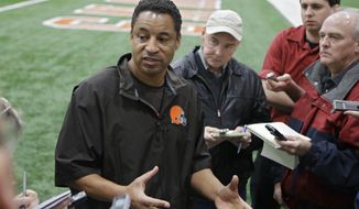 Cleveland Browns defensive coordinator Ray Horton talks to reporters after practice at the NFL football team&#x27;s facility in Berea, Ohio Thursday, Dec. 19, 2013. Two coaches joined Brian Flores on Thursday, April 7, 2022, in his lawsuit alleging racist hiring practices by the NFL toward coaches and general managers. The updated lawsuit in Manhattan federal court added coaches Steve Wilks and Ray Horton. (AP Photo/Mark Duncan) **FILE**