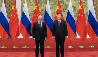 In this photo provided by China&#39;s Xinhua News Agency, Chinese President Xi Jinping, right, pose for photos with Russian President Vladimir Putin at the Diaoyutai State Guesthouse in Beijing, China, on Feb. 4, 2022. China has described reports and images of civilian killings in Ukraine as disturbing, and urged that they be further investigated, even while declining to blame Russia. That&#39;s drawn questions about the resiliency of Beijing&#39;s support for Moscow, but speculation that it is weakening appears to be misplaced. (Li Tao/Xinhua via AP, File)