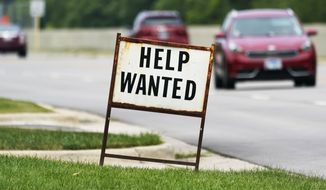 A help wanted sign is displayed at a gas station in Mount Prospect, Ill., Tuesday, July 27, 2021.  Fewer Americans applied for unemployment benefits last week as layoffs remain at historically low levels.  Jobless claims fell by 5,000 to 166,000 for the week ending April 2, 2022 the Labor Department reported Thursday.  (AP Photo/Nam Y. Huh)  **FILE**