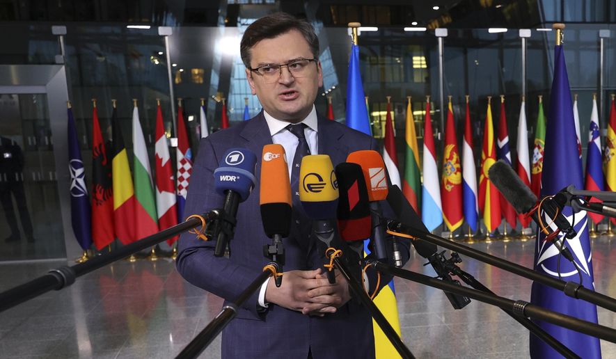 Ukraine&#x27;s Foreign Minister Dmytro Kuleba speaks with the media as he arrives for a meeting of NATO foreign ministers at NATO headquarters in Brussels, Thursday, April 7, 2022. NATO foreign ministers are meeting to discuss how to bolster their support to Ukraine, including by supplying weapons to the conflict-torn country, without being drawn into a wider war with Russia. (AP Photo/Olivier Matthys)