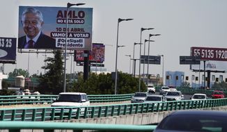 A billboard featuring Mexico&#39;s President Andres Manuel Lopez Obrador with a message encouraging citizens to get out and vote towers over a highway in Mexico City, Saturday, March 26, 2022. On April 10, a presidential recall referendum will be held to revalidate his administration after three years in office. Mexicans will be asked if they want the president to continue in office until 2024 or resign. (AP Photo/Marco Ugarte)