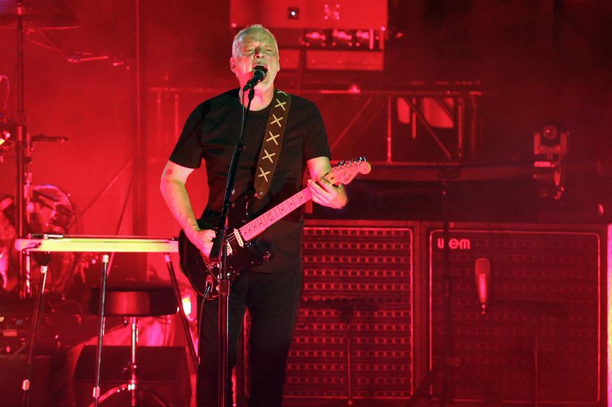 David Gilmour performs in the ancient roman amphitheater of the Pompeii archeological site, Italy, Thursday, July 7, 2016. Pink Floyd is releasing its first new music in almost three decades to raise money for the people of Ukraine, the band announced Thursday, April 7, 2022. “Hey Hey Rise Up” features Pink Floyd members David Gilmour and Nick Mason, with vocals from Ukrainian singer Andriy Khlyvnyuk of the band BoomBox. (AP Photo/Gregorio Borgia, File)