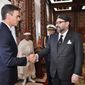 FILE - This photo provided by the Moroccan Royal Palace shows Spanish Prime Minister Pedro Sanchez, left, greeted by Moroccan King Mohammed VI prior to their lunch at the Royal Palace in Rabat, Morocco, Nov. 19, 2018. Sanchez is set to meet with Moroccan King Mohammed VI on Thursday, April 7, 2022 during a two-day visit to Rabat that promises to mark a mending of diplomatic tensions centered on the disputed region of Western Sahara. Relations were damaged last April when Morocco was angered by Spain allowing the leader of the pro-independence movement for Western Sahara to receive medical treatment. (Moroccan Royal Palace via AP, File)