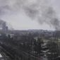Smoke rises after shelling in Mariupol, Ukraine, March 9, 2022. An Associated Press team of journalists was in Mariupol the day of the airstrike and raced to the scene. Their images prompted a massive Russian misinformation campaign that continues to this day. (AP Photo/Evgeniy Maloletka, File)