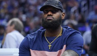 Los Angeles Lakers&#x27; LeBron James sits on the bench during the first half of the team&#x27;s NBA basketball game against the Golden State Warriors in San Francisco, Thursday, April 7, 2022. (AP Photo/Jeff Chiu)