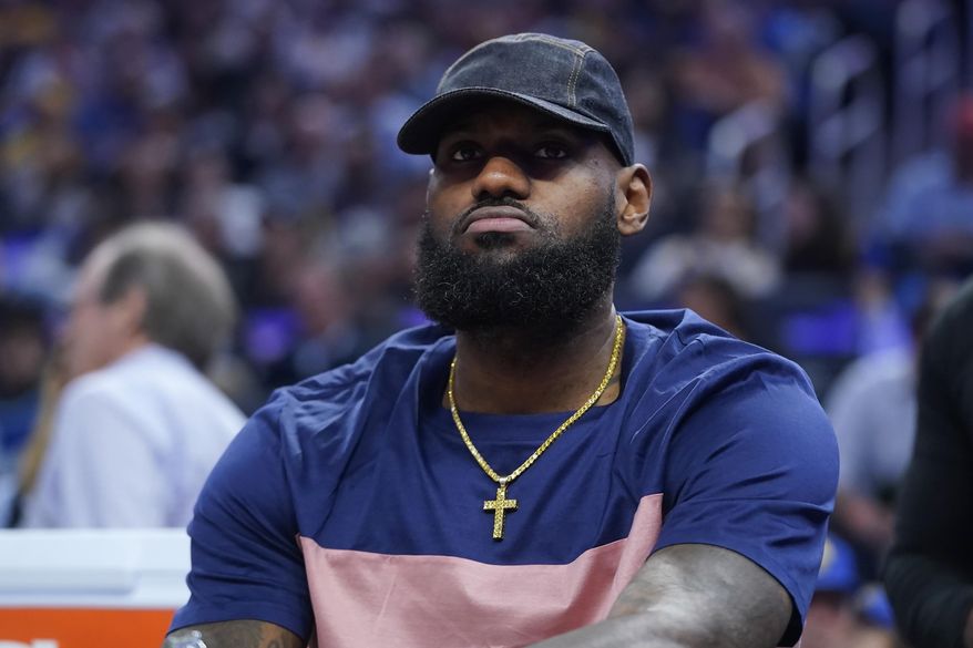 Los Angeles Lakers&#39; LeBron James sits on the bench during the first half of the team&#39;s NBA basketball game against the Golden State Warriors in San Francisco, Thursday, April 7, 2022. (AP Photo/Jeff Chiu)