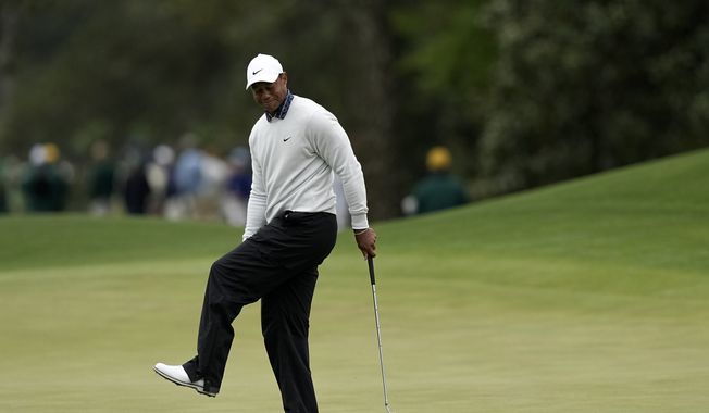 Tiger Woods reacts after missing a birdie putt on the eighth green during the third round at the Masters golf tournament on Saturday, April 9, 2022, in Augusta, Ga. (AP Photo/David J. Phillip)