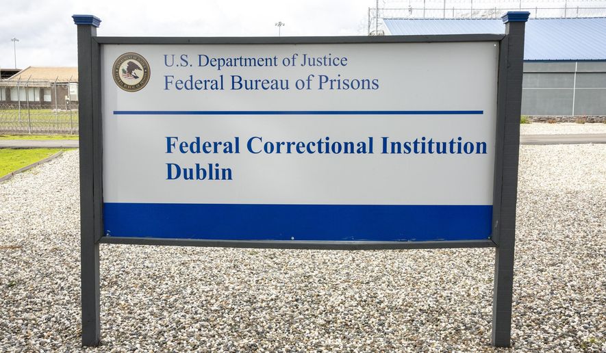 FILE - A sign for the Federal Correctional Institution Dublin is displayed on Jan. 9, 2019, in Dublin, Calif. A government watchdog has found a “substantial likelihood” the federal Bureau of Prisons committed wrongdoing when it ignored complaints and failed to address asbestos and mold contamination at the federal women’s prison that has already been under scrutiny for rampant sexual abuse of inmates. (Santiago Mejia/San Francisco Chronicle via AP, File)