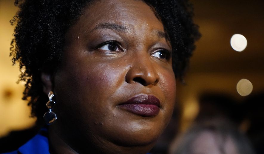 Georgia gubernatorial Democratic candidate Stacey Abrams talks to the media after qualifying for the 2022 election on Tuesday, March 8, 2022, in Atlanta. When she ended her first bid to become Georgia governor in 2018, Abrams announced plans to sue over the way the state’s elections were managed. More than three years later, as she makes another run at the governor’s mansion, the lawsuit filed in Nov. 2018 by Abrams&#39; Fair Fight Action organization is finally going to trial on Monday, April 11. (AP Photo/Brynn Anderson, File)