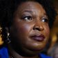 Georgia gubernatorial Democratic candidate Stacey Abrams talks to the media after qualifying for the 2022 election on Tuesday, March 8, 2022, in Atlanta. When she ended her first bid to become Georgia governor in 2018, Abrams announced plans to sue over the way the state’s elections were managed. More than three years later, as she makes another run at the governor’s mansion, the lawsuit filed in Nov. 2018 by Abrams&#39; Fair Fight Action organization is finally going to trial on Monday, April 11. (AP Photo/Brynn Anderson, File)