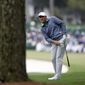 Scottie Scheffler watches his second shot on the first fairway during the third round of the Masters golf tournament at Augusta National on Saturday, April 9, 2022, in Augusta, Ga. (Curtis Compton/Atlanta Journal-Constitution via AP)