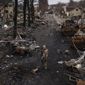 A Ukrainian serviceman stands amid destroyed Russian tanks in Bucha, on the outskirts of Kyiv, Ukraine, Wednesday, April 6, 2022. (AP Photo/Felipe Dana) **FILE**