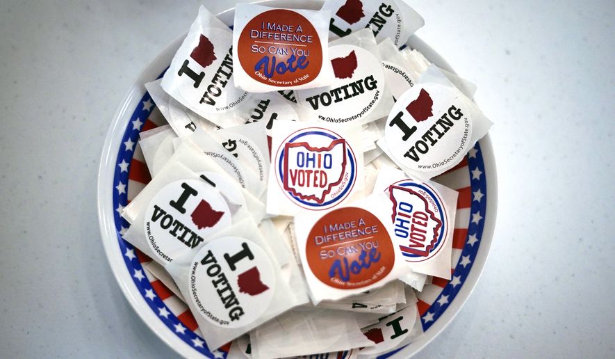 This is a bowl of stickers waiting for voters after they cast their early ballot at the Jefferson County Board of Elections office in Steubenville, Ohio, on Monday, April 4, 2022. Early voting began Tuesday, April 5 in Ohio. (AP Photo/Gene J. Puskar)