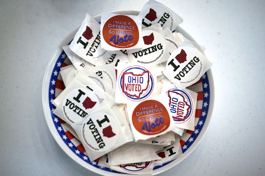 This is a bowl of stickers waiting for voters after they cast their early ballot at the Jefferson County Board of Elections office in Steubenville, Ohio, on Monday, April 4, 2022. Early voting began Tuesday, April 5 in Ohio. (AP Photo/Gene J. Puskar)