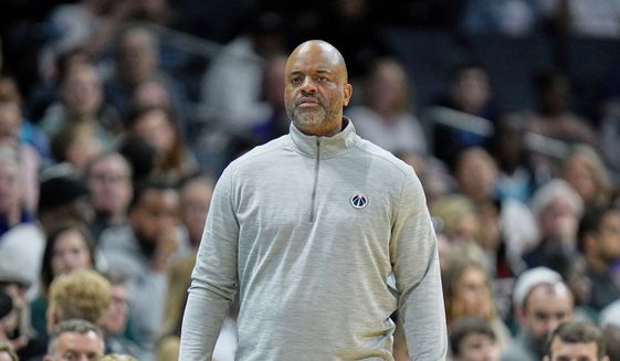 Washington Wizards head coach Wes Unseld Jr. watches a play during an NBA basketball game against the Charlotte Hornets on Sunday, April 10, 2022, in Charlotte, N.C. (AP Photo/Rusty Jones) **FILE**