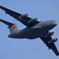FILE - A Y-20 transport aircraft of the Chinese People&#39;s Liberation Army (PLA) Air Force performs during the 12th China International Aviation and Aerospace Exhibition, also known as Airshow China 2018, in Zhuhai city, southern China on Nov. 7, 2018. Media and military experts said Sunday, April 10, 2022, that six Chinese Air Force Y-20 transport planes landed at Belgrade&#39;s commercial airport early Saturday, reportedly carrying HQ-22 surface-to-air missile systems for the Serbian military.(AP Photo/Kin Cheung, File)