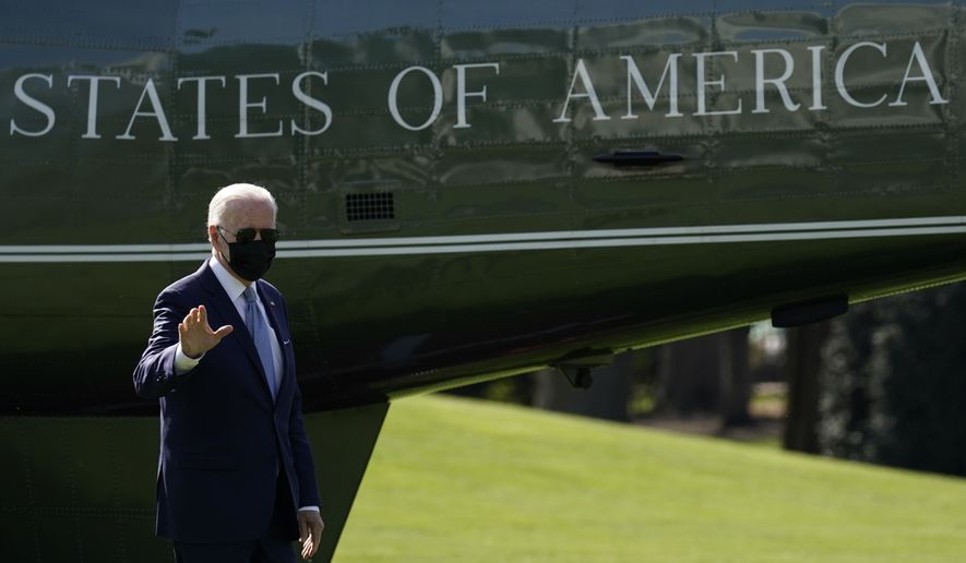 President Joe Biden waves as he arrives on Marine One on the South Lawn of the White House in Washington, Monday, April 11, 2022, as he returns from Wilmington, Del. (AP Photo/Carolyn Kaster)