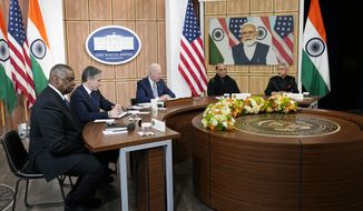 President Joe Biden meets virtually with Indian Prime Minister Narendra Modi in the South Court Auditorium on the White House campus in Washington, Monday, April 11, 2022. Secretary of Defense Lloyd Austin, left, and Secretary of State Antony Blinken, second left, and Indian Minister of Defense Rajnath Singh, second right, Minister of External Affairs Subrahmanyam Jaishankar is right.  (AP Photo/Carolyn Kaster)
