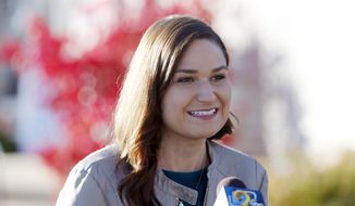 In this Nov. 3, 2020, photo, Abby Finkenauer talks with journalists at the Linn County Democrats&#39; office in Cedar Rapids, Iowa. A state court judge has concluded that Democrat Abby Finkenauer cannot appear on the June 7 primary ballot for U.S. Senate, knocking off the candidate considered by many to be the party&#39;s leader in the effort to challenge U.S. Sen. Charles Grassley. (Liz Martin/The Gazette via AP) **FILE**