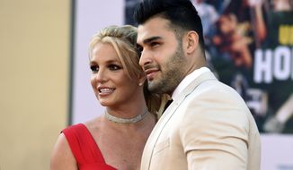 Britney Spears and Sam Asghari arrive at the Los Angeles premiere of &quot;Once Upon a Time in Hollywood,&quot; at the TCL Chinese Theatre, Monday, July 22, 2019. Spears, less than five months after her conservatorship ended, confused some fans Monday, April 11, 2022, when she posted on Instagram that she&#39;s pregnant, and apparently married. (Photo by Jordan Strauss/Invision/AP, File)