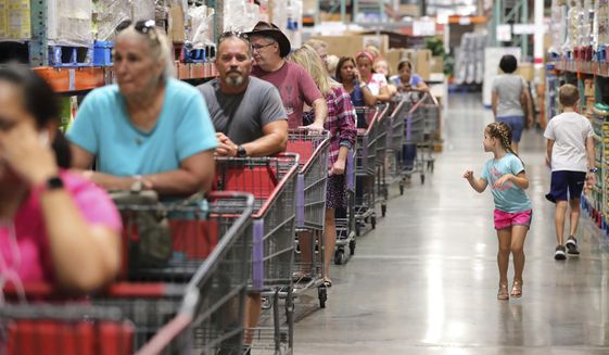 Shoppers wait in line at the Costco store in Altamonte Springs, Fla. on Aug. 30, 2019. (Joe Burbank/Orlando Sentinel via AP, File)