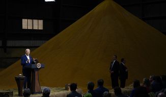 President Joe Biden speaks, with a pile of corn meal as a backdrop, at POET Bioprocessing in Menlo, Iowa, Tuesday, April 12, 2022. (AP Photo/Carolyn Kaster)