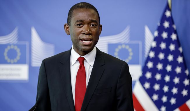 U.S. Deputy Secretary of the Treasury Wally Adeyemo speaks during a joint media conference with European Commissionner for Financial services Mairead McGuinness at EU headquarters in Brussels, Tuesday, March 29, 2022. (Johanna Geron, Pool Photo via AP)