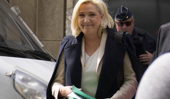 FILE - French far-right candidate Marine Le Pen leaves her campaign headquarters in Paris, Monday, April 11, 2022. French President Emmanuel Macron, the incumbent president with strong pro-European views, and Marine Le Pen, an anti-immigration nationalist, couldn&#x27;t have more radically opposed visions of the EU. A win for far-right candidate Marine Le Pen in France&#x27;s presidential race would have immense repercussions on the functioning of the European Union. (AP Photo/Francois Mori, File)