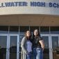 Angela Morgan, left, and her daughter Sidney McLaughlin stand in front of Stillwater High School in Stillwater, Okla., March 15, 2022. Nearly 50 years after Congress passed the sweeping law that guarantees equity in “any education program or activity receiving Federal financial assistance,” including high school athletics, girls are stuck in an imperfect system that continues to favor boys. (Jason Elquist/Elm Tree Photo via AP) **FILE**