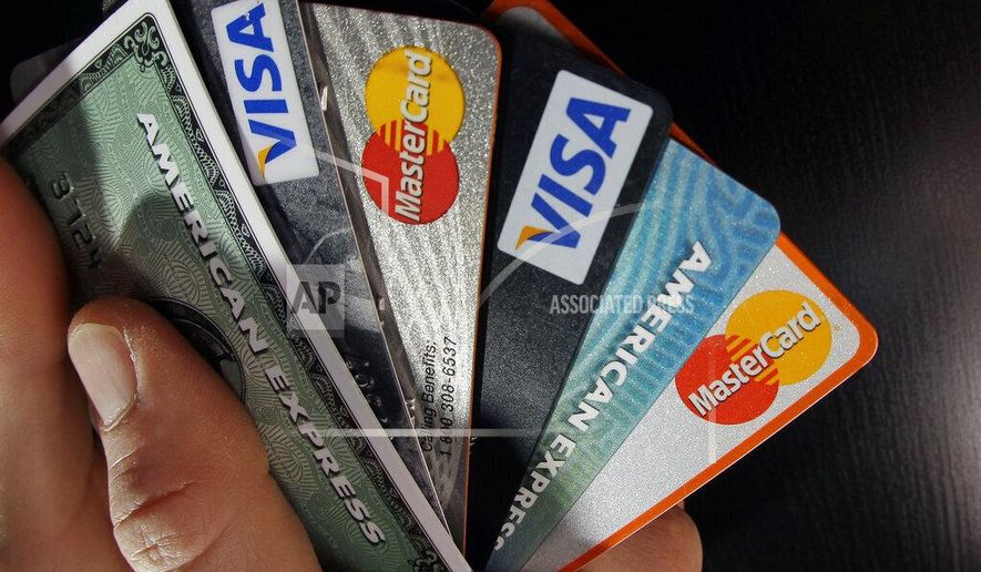 In this March 5, 2012, photo, consumer credit cards are posed in North Andover, Mass. (AP Photo/Elise Amendola) **FILE**