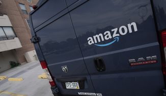 The company logo graces one of the doors of a delivery van for Amazon Wednesday, Sept. 1, 2021, in Denver. Amazon said Wednesday, April 13, 2022 it will add a 5% “fuel and inflation surcharge” to fees it charges third-party sellers who use the retailer’s fulfillment services as the company faces rising costs. The company said in an announcement on its website that the added fees will take effect on April 28 and are subject to change. Federal data released Tuesday showed inflation hit 8.5% in March, its fastest pace in more than 40 years. (AP Photo/David Zalubowski, file)  **FILE**