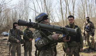 Ukrainian servicemen study a Sweden shoulder-launched weapon system Carl Gustaf M4 during a training session on the near Kharkiv, Ukraine, April 7, 2022. Western weaponry pouring into Ukraine helped blunt Russia&#39;s initial offensive and seems certain to play a central role in the approaching battle for Ukraine&#39;s contested Donbas region. Yet the Russian military is making little headway halting what has become a historic arms express. (AP Photo/Andrew Marienko, File)