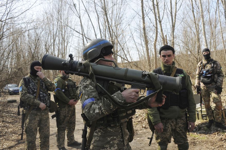 Ukrainian servicemen study a Sweden shoulder-launched weapon system Carl Gustaf M4 during a training session on the near Kharkiv, Ukraine, April 7, 2022. Western weaponry pouring into Ukraine helped blunt Russia&#x27;s initial offensive and seems certain to play a central role in the approaching battle for Ukraine&#x27;s contested Donbas region. Yet the Russian military is making little headway halting what has become a historic arms express. (AP Photo/Andrew Marienko, File)