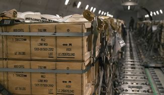 In this image provided by the U.S. Air Force, pallets of ammunition, weapons and other equipment bound for Ukraine are loaded on a plane by members from the 436th Aerial Port Squadron during a foreign military sales mission at Dover Air Force Base, Del., on Jan. 30, 2022. Western weaponry pouring into Ukraine helped blunt Russia&#39;s initial offensive and seems certain to play a central role in the approaching battle for Ukraine&#39;s contested Donbas region. Yet the Russian military is making little headway halting what has become a historic arms express. (Senior Airman Stephani Barge/U.S. Air Force via AP)