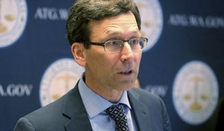 Attorney General Bob Ferguson announces a Juul settlement, Wednesday, April 13, 2022. E-cigarette giant Juul Labs will pay $22.5 million to settle a lawsuit brought by Washington that alleged it intentionally targeted its products at teenagers, while deceiving consumers about the addictiveness of its vaping products. (Greg Gilbert/The Seattle Times via AP)