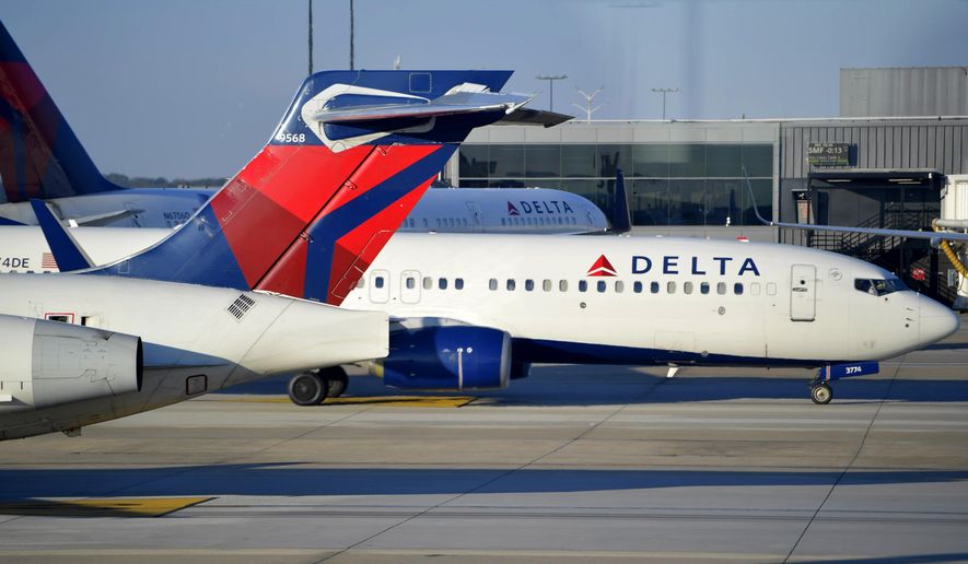 A Delta Airlines aircraft taxi&#x27;s on Thursday, Dec. 2, 2021, at Hartsfield-Jackson Atlanta International Airport, in Atlanta. (AP Photo/Mike Stewart) ** FILE **