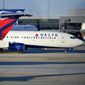 A Delta Airlines aircraft taxi&#39;s on Thursday, Dec. 2, 2021, at Hartsfield-Jackson Atlanta International Airport, in Atlanta. (AP Photo/Mike Stewart) ** FILE **