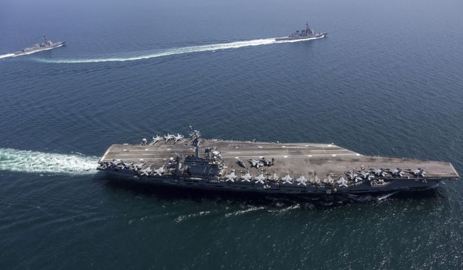 This undated photo provided by the U.S. Navy on April 13, 2022, shows USS Abraham Lincoln, front, and other warships sail in formation during a U.S.-Japan bilateral exercise at the Sea of Japan. U.S. and Japanese warships, led by the USS Abraham Lincoln carrier strike group, are conducting their joint naval exercise in waters between Japan and the Korean Peninsula for the first time in five yeas, in a show of their close military alliance amid growing speculation of North Korea&#x27;s missile or nuclear testing later this week. (U.S. Navy via AP)