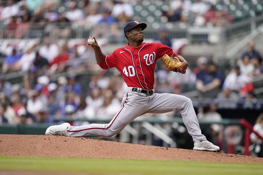 Washington Nationals starting pitcher Josiah Gray (40) works during the first inning of a baseball game against the Atlanta Braves, Wednesday, April 13, 2022, in Atlanta. (AP Photo/Brynn Anderson)