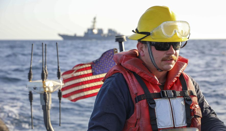 In this photo released by the U.S. Navy, Boatswain&#39;s Mate 2nd Class Hunter Pemberton assigned to the USS Cole takes part in an exercise on the Red Sea March 29, 2022. The U.S. Navy said Wednesday, April 13, 2022, that it will begin a new task force with allied countries to patrol the Red Sea after a series of attacks attributed to Yemen&#39;s Houthi rebels in a waterway that&#39;s essential to global trade. (Mass Communication Specialist Seaman Christopher Stachyra/U.S. Navy, AP)
