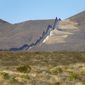 Newly erected border wall separating Mexico, left, and the United States, cuts through through the Sonoran Desert just west of the San Bernardino National Wildlife Refuge, Wednesday, Dec. 9, 2020, in Douglas, Ariz. (AP Photo/Matt York,File)