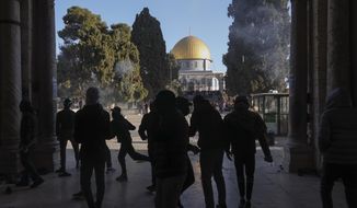 Palestinians clash with Israeli security forces at the Al-Aqsa mosque compound in Jerusalem&#39;s Old City Friday, April 15, 2022. (AP Photo/Mahmoud Illean)