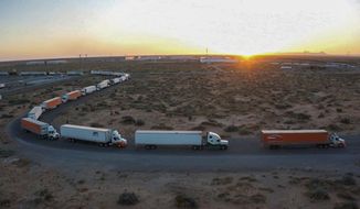 Truckers block the entrance into the Santa Teresa Port of Entry in Ciudad Juarez going into New Mexico on April 12, 2022. The truckers blocked the port as a protest to the prolonged processing times implemented by Gov. Abbott which they say have increased from 2-3 hours up to 14 hours in the last few days. (Omar Ornelas /The El Paso Times via AP)
