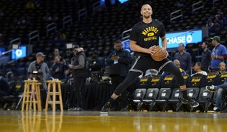 Golden State Warriors guard Stephen Curry warms up before Game 1 of the team&#39;s NBA basketball first-round playoff series against the Denver Nuggets in San Francisco, Saturday, April 16, 2022. (AP Photo/Jeff Chiu)