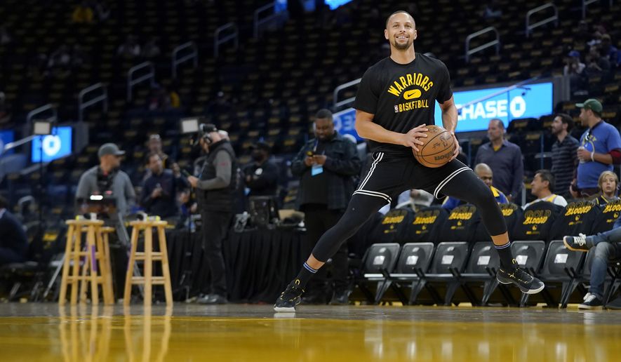 Golden State Warriors guard Stephen Curry warms up before Game 1 of the team&#x27;s NBA basketball first-round playoff series against the Denver Nuggets in San Francisco, Saturday, April 16, 2022. (AP Photo/Jeff Chiu)