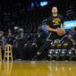 Golden State Warriors guard Stephen Curry warms up before Game 1 of the team&#39;s NBA basketball first-round playoff series against the Denver Nuggets in San Francisco, Saturday, April 16, 2022. (AP Photo/Jeff Chiu)