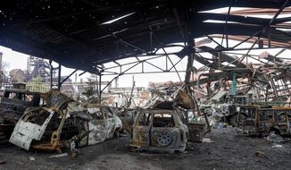 The gutted remains of vehicles are seen at the Illich Iron &amp;amp; Steel Works Metallurgical Plant, the second largest metallurgical enterprise in Ukraine, in an area controlled by Russian-backed separatist forces in Mariupol, Ukraine, Saturday, April 16, 2022. Mariupol, a strategic port on the Sea of Azov, has been besieged by Russian troops and forces from self-proclaimed separatist areas in eastern Ukraine for more than six weeks. (AP Photo/Alexei Alexandrov)
