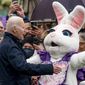 President Joe Biden appears with first lady Jill Biden and the Easter Bunny on the Blue Room balcony at the White House, Monday, April 18, 2022. (AP Photo/Andrew Harnik)