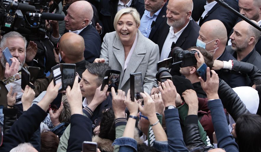 French far-right leader and presidential candidate Marine Le Pen campaigns, Monday, April 18, 2022 in Saint-Pierre-en-Auge, Normandy. French President Emmanuel Macron is facing off against far-right challenger Marine Le Pen in France&#39;s April 24 presidential runoff. (AP Photo/Jeremias Gonzalez)
