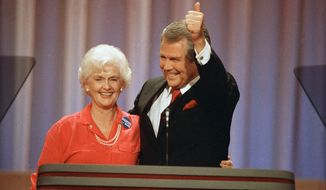 Former Republican presidential hopeful Pat Robertson gives a thumbs-up as he and his wife, Dede, acknowledge applause at the Republican National Convention in New Orleans, Tuesday, August 17, 1988. Adelia “Dede” Robertson, the wife of religious broadcaster Pat Robertson as well as an author and founding board member of the Christian Broadcasting Network, died Tuesday, April 19, 2022, at her home in Virginia Beach. She was 94. (AP Photo/Ron Edmonds, File)